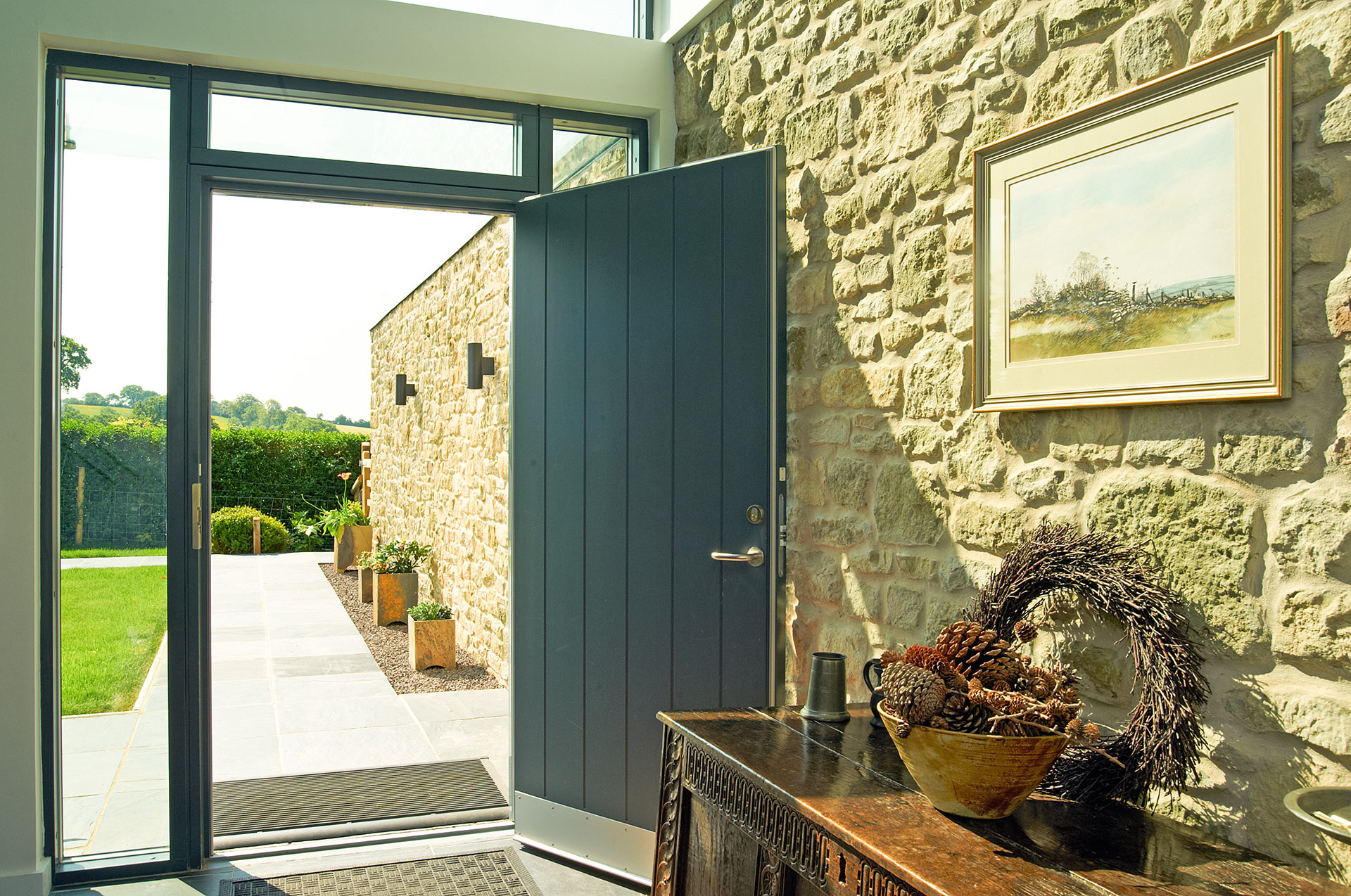 interior entrance hall with internal and external exposed stone wall