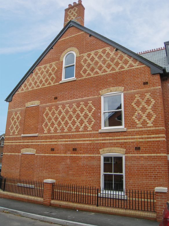 Brick detail on outside wall with feature windows