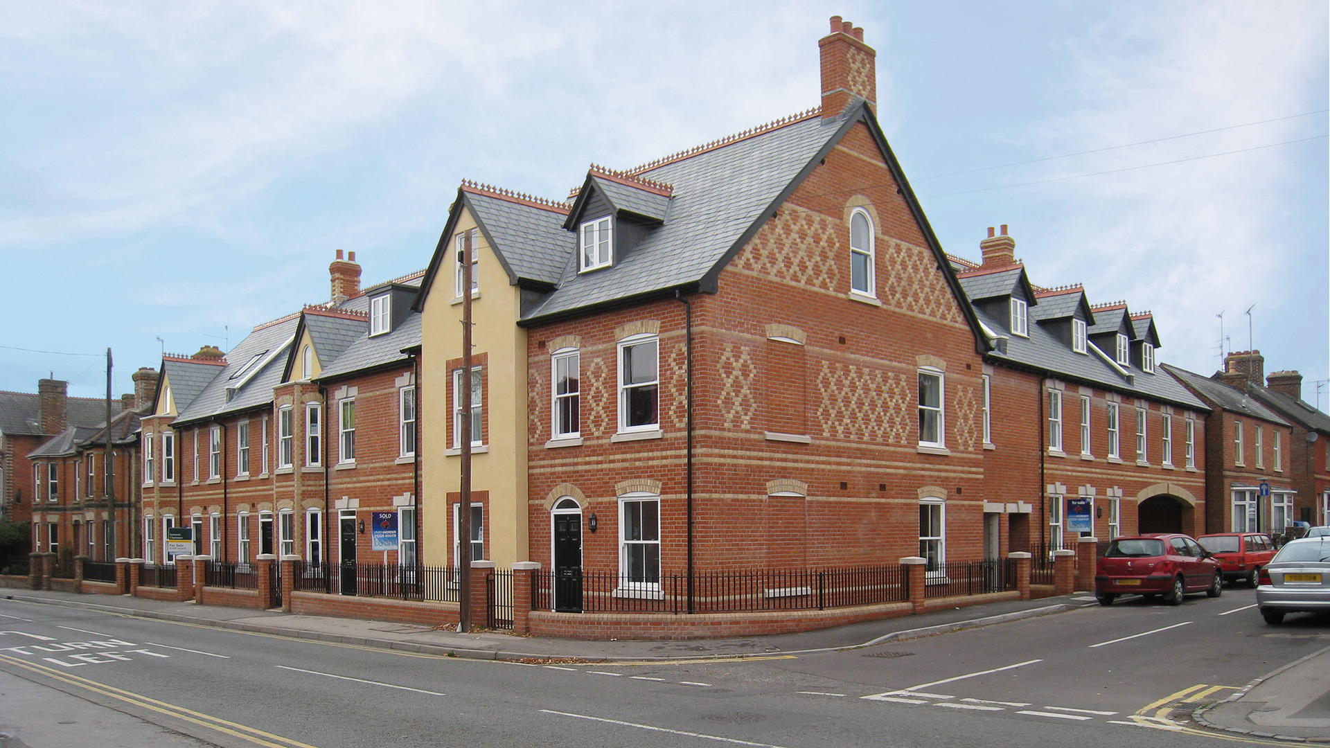 Attractive brick townhouses on corner of road