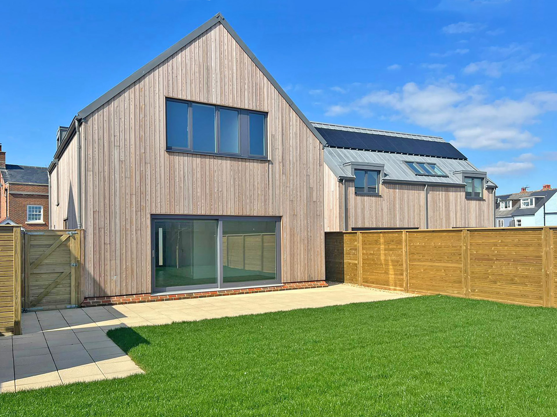 garden view of modern house with timber cladding