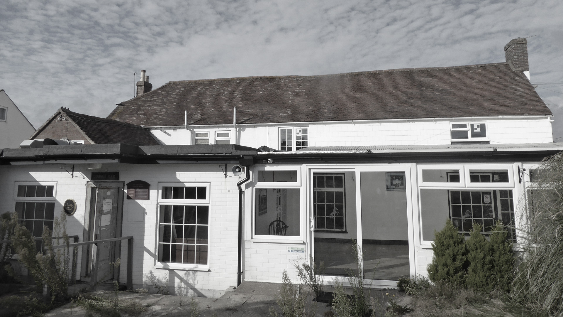 before photo of rear of pub with conservatory