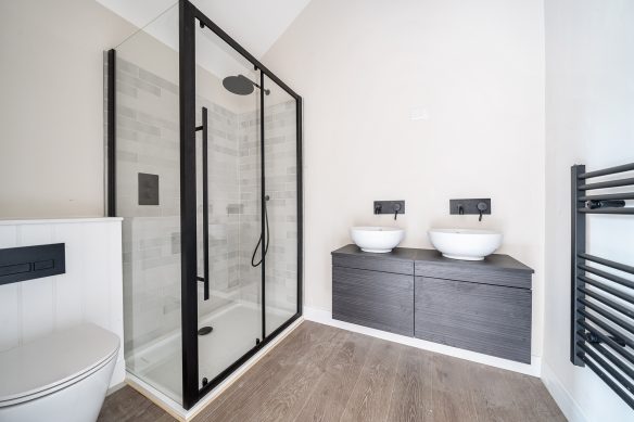 modern bathroom in black and white tones with double sinks