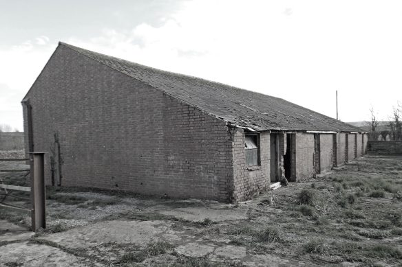 before photo of barns in need of repair