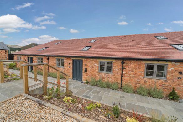 beautiful barn conversion with red tiles roof and sky lights