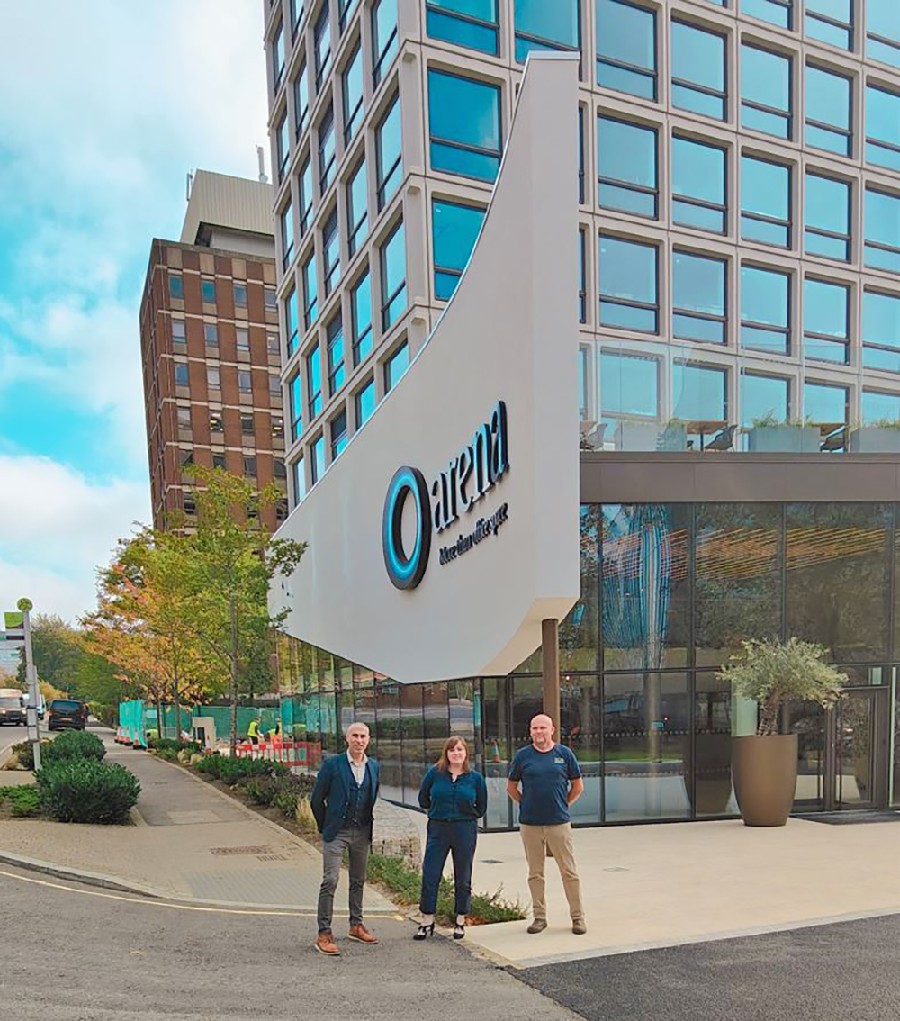 design team outside modern office block