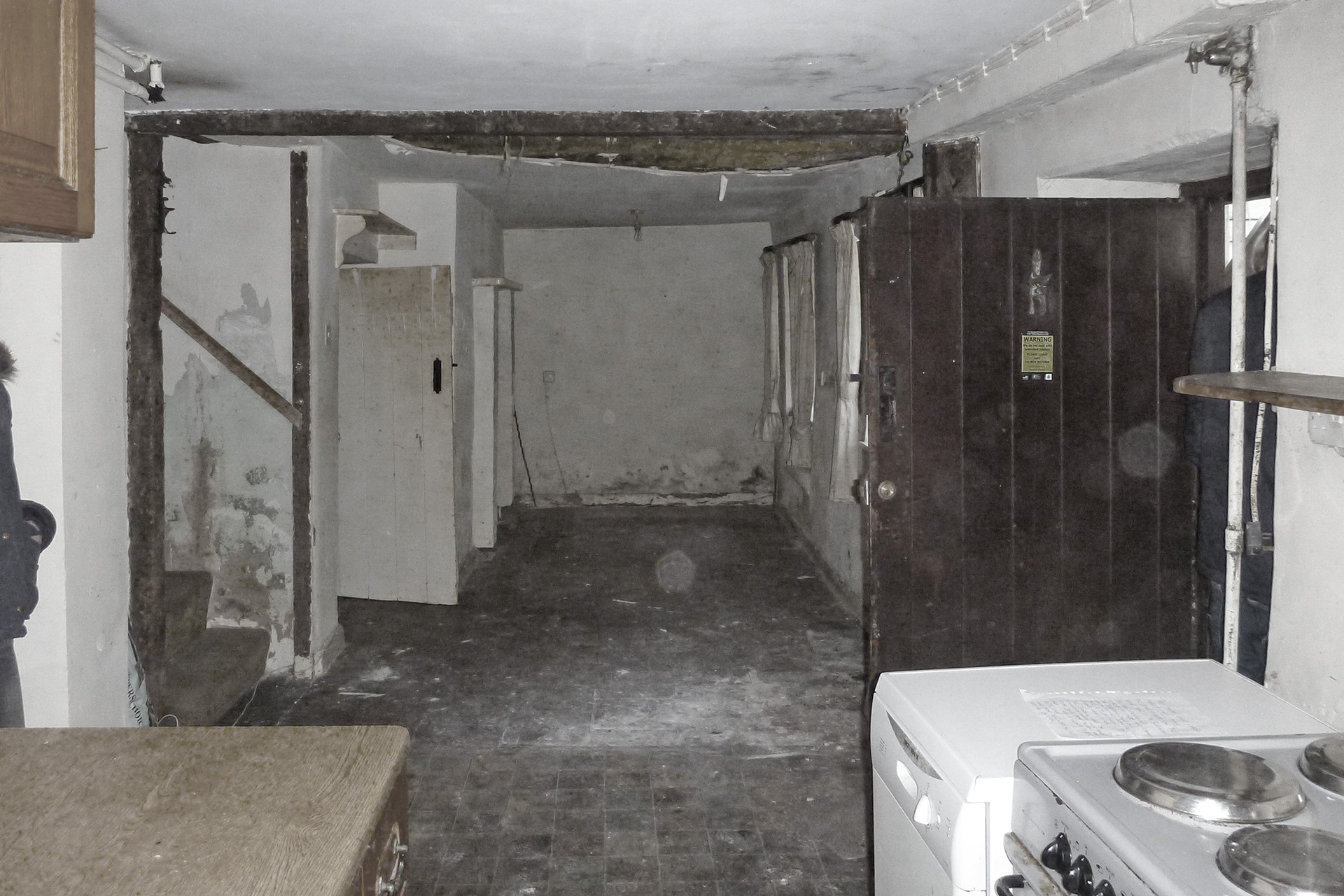 before photo of kitchen passage in house in need of restoration
