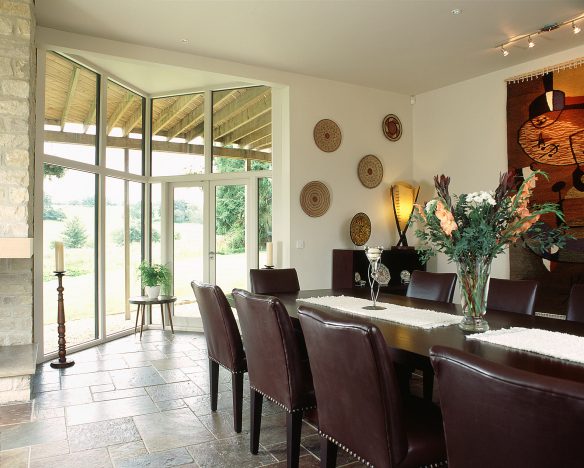 dining area with large table and chairs with feature patio door leading outside