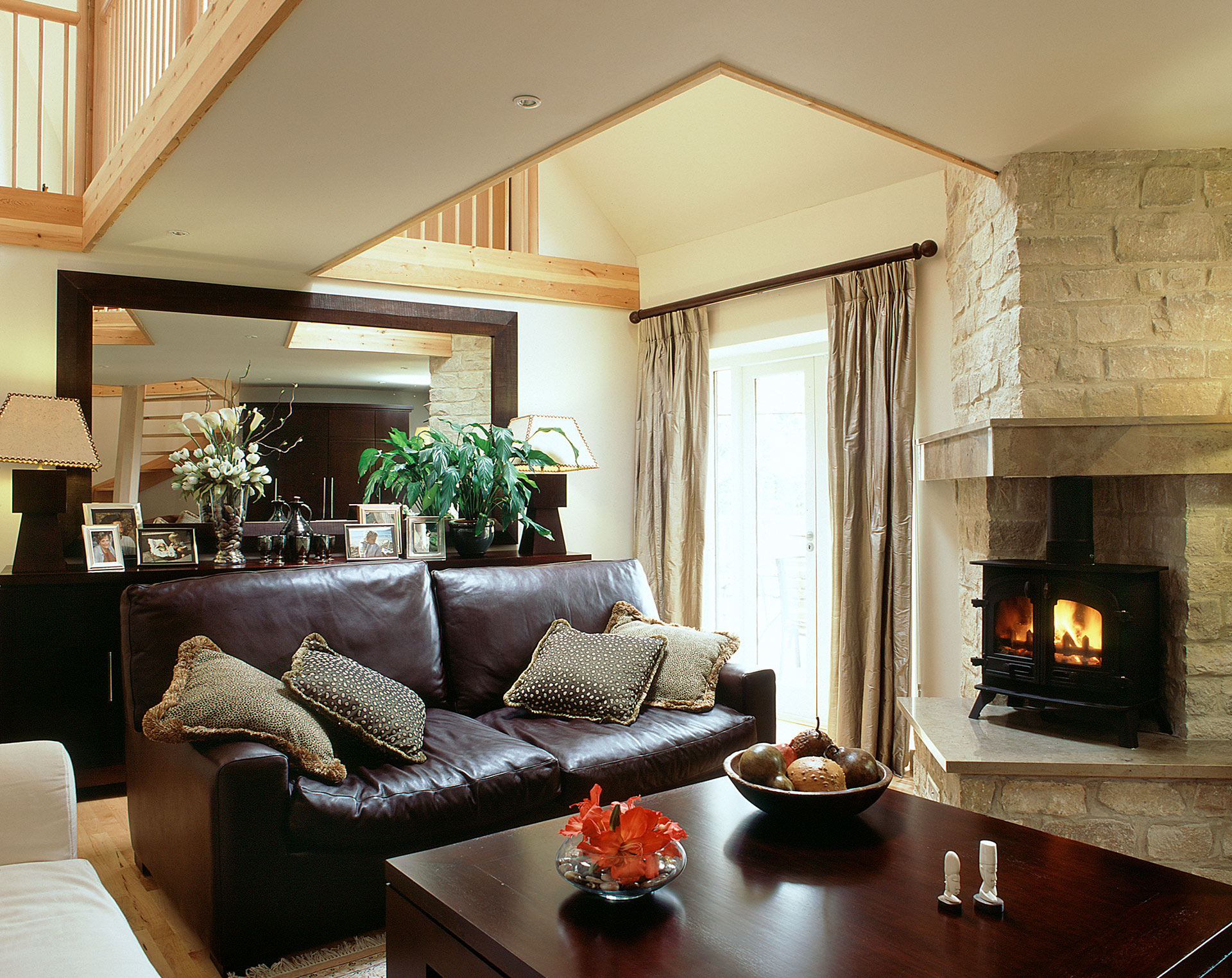 living space with internal corner fireplace and walkway on first floor