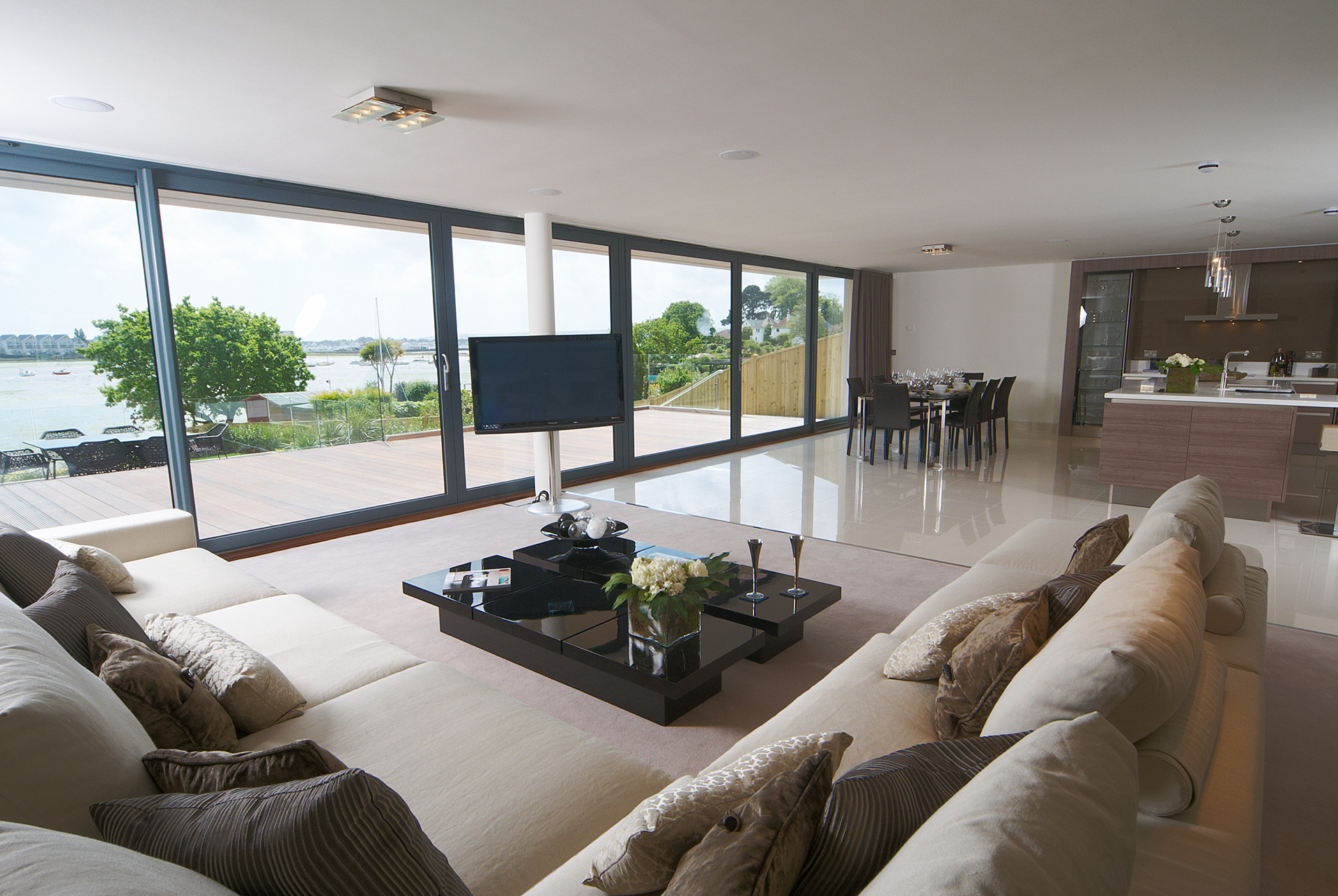 open plan living dining room with sea views