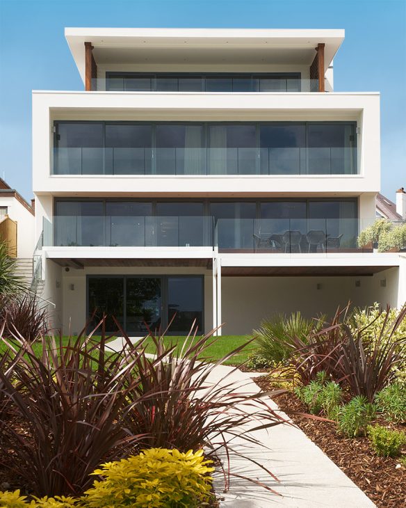 rear view of modern white house with balconies