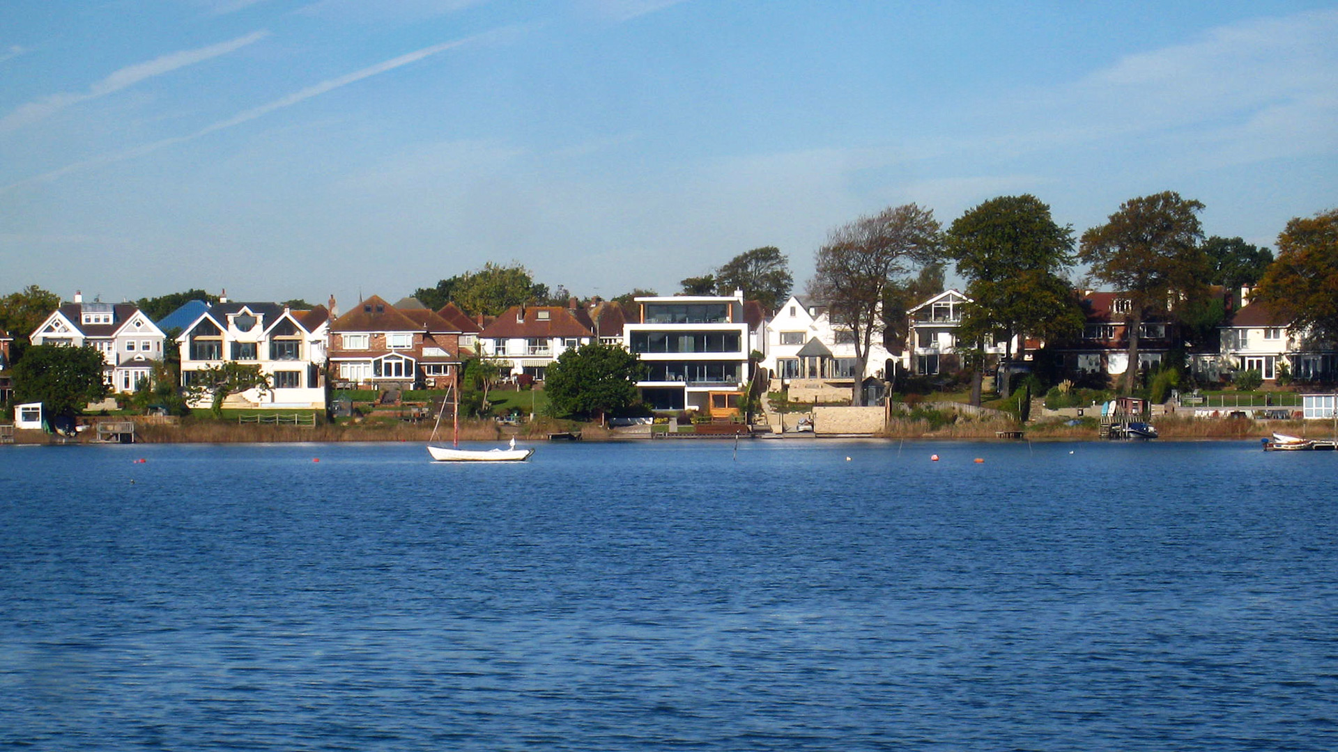 view of houses from boat across sea