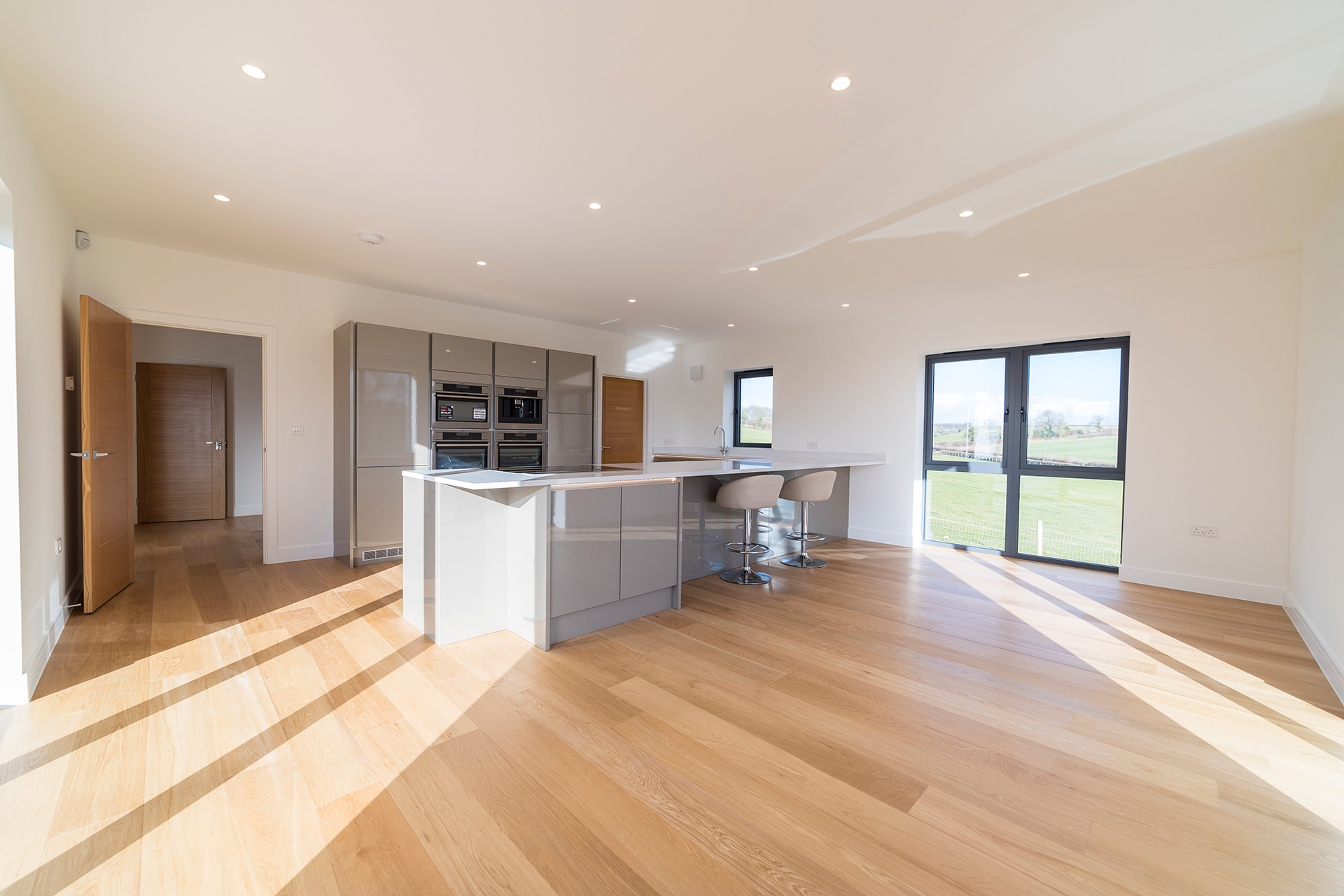 large open plan modern kitchen area with kitchen island