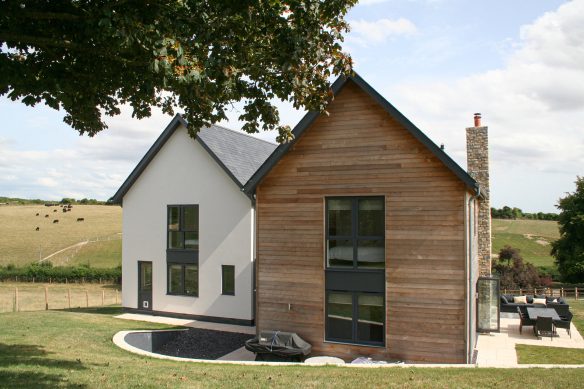rear view of house with timber cladding and countryside views