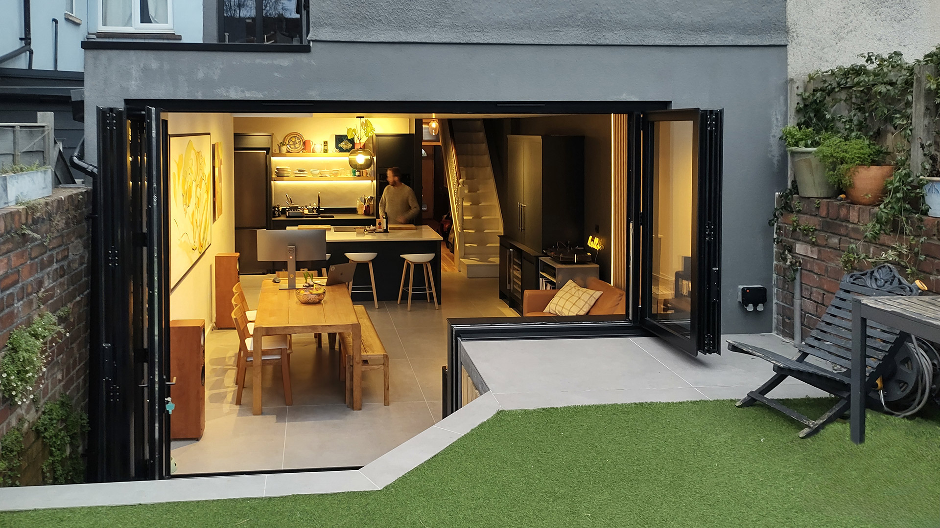 contemporary kitchen and living area extension to house with elevated garden