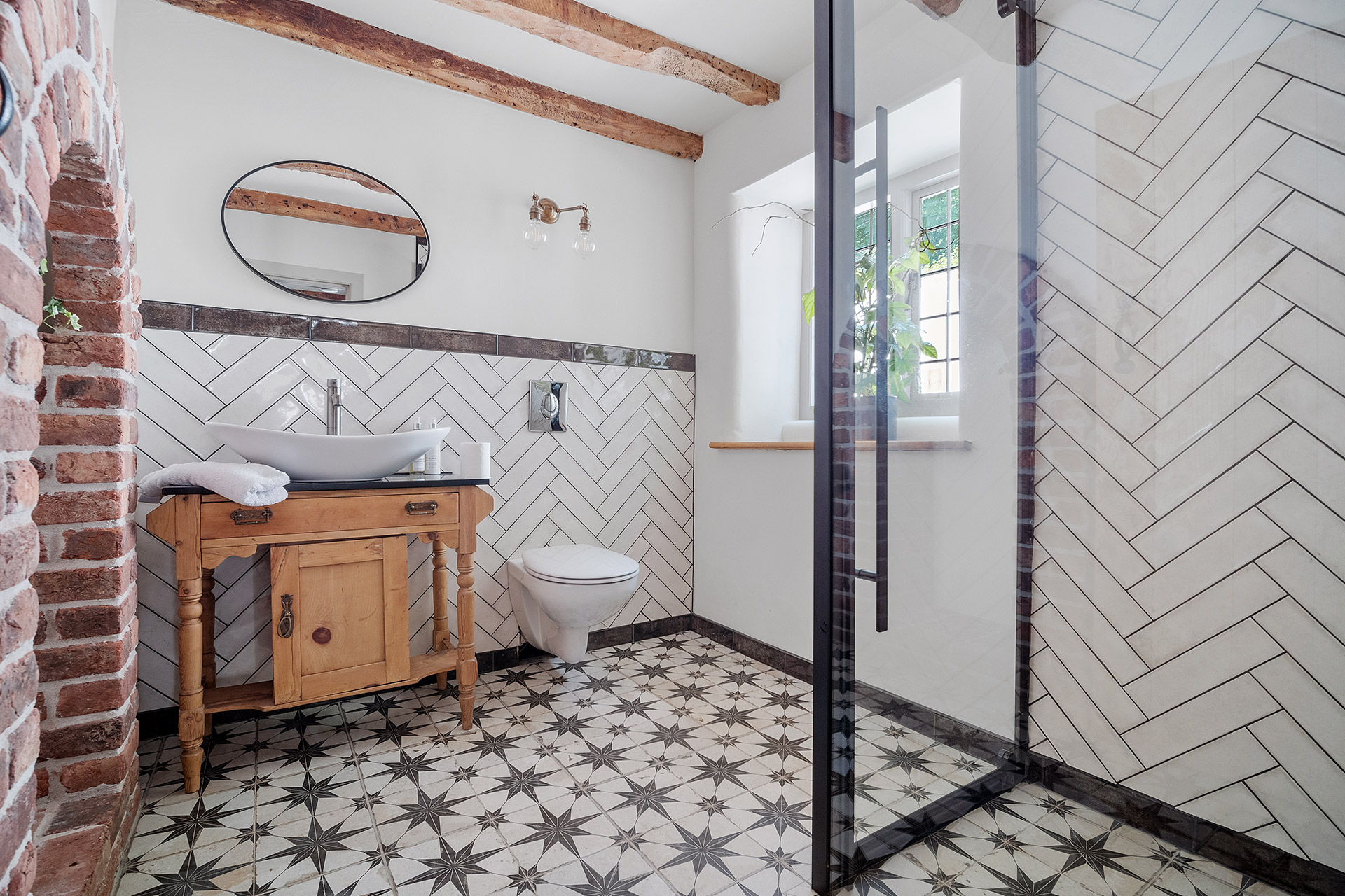 modern bathroom with large shower and patterned tile floor