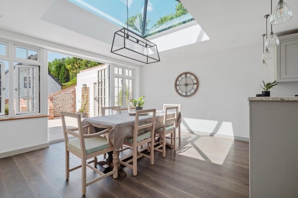 modern dining area with patio doors and roof light