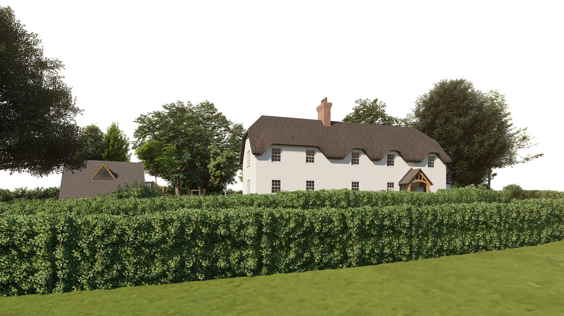 visual of front view of large thatched house behind hedge