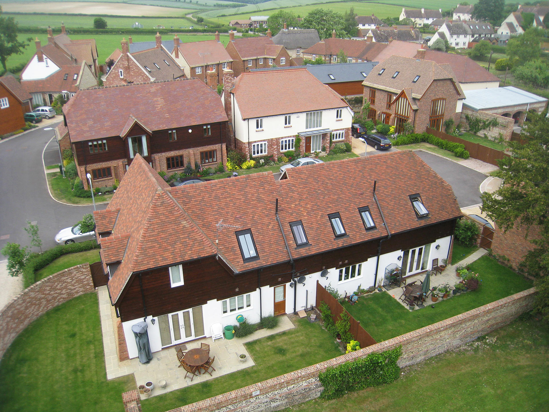 aerial view of houses with neat back gardens
