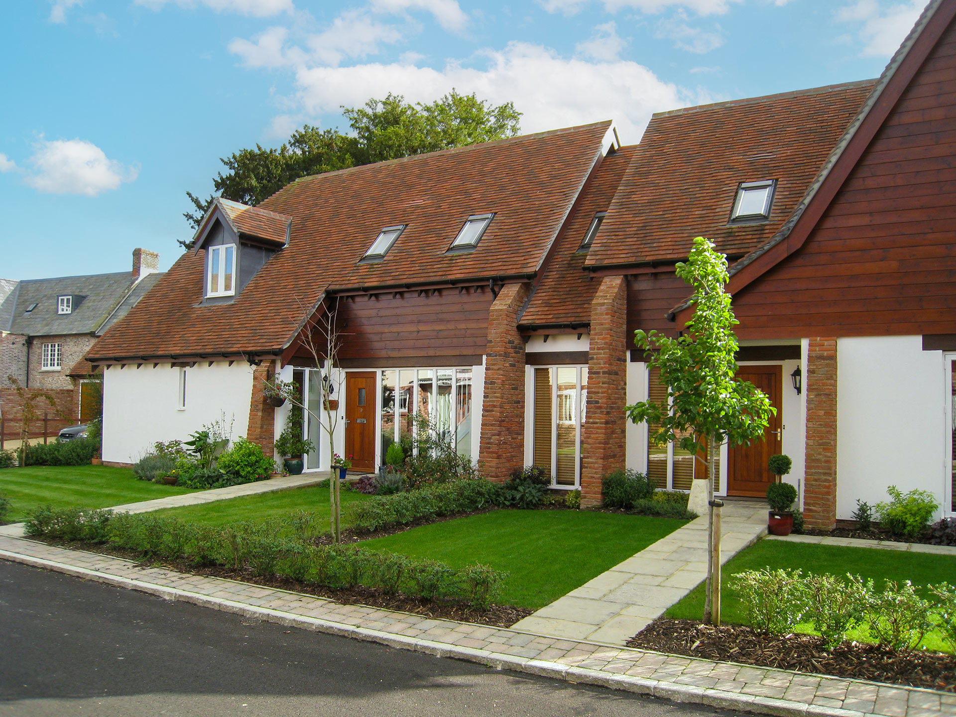 chalet style houses with neat front gardens