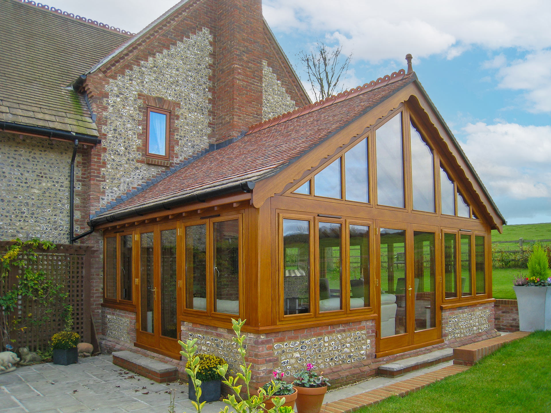 garden room extension with windows and flint details on wall