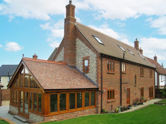 manor farm house with sun room extension