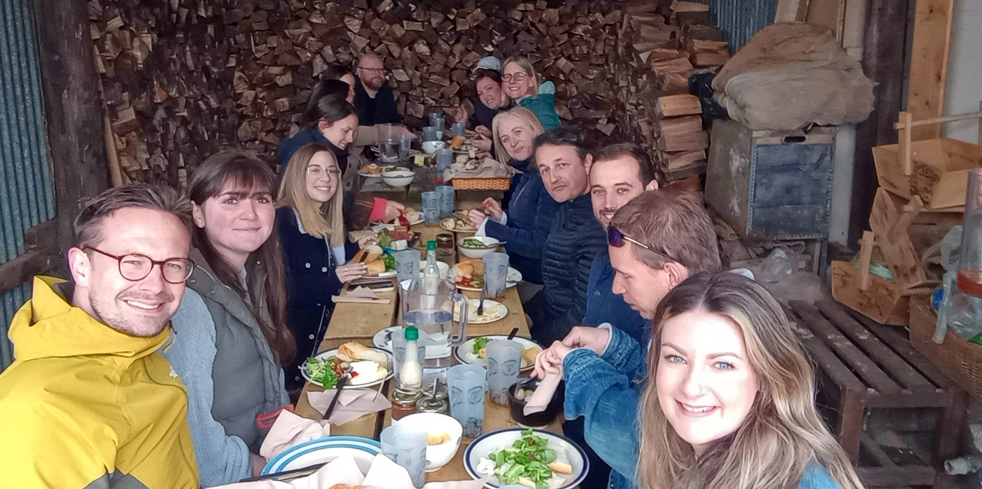 staff sitting around table eating lunch