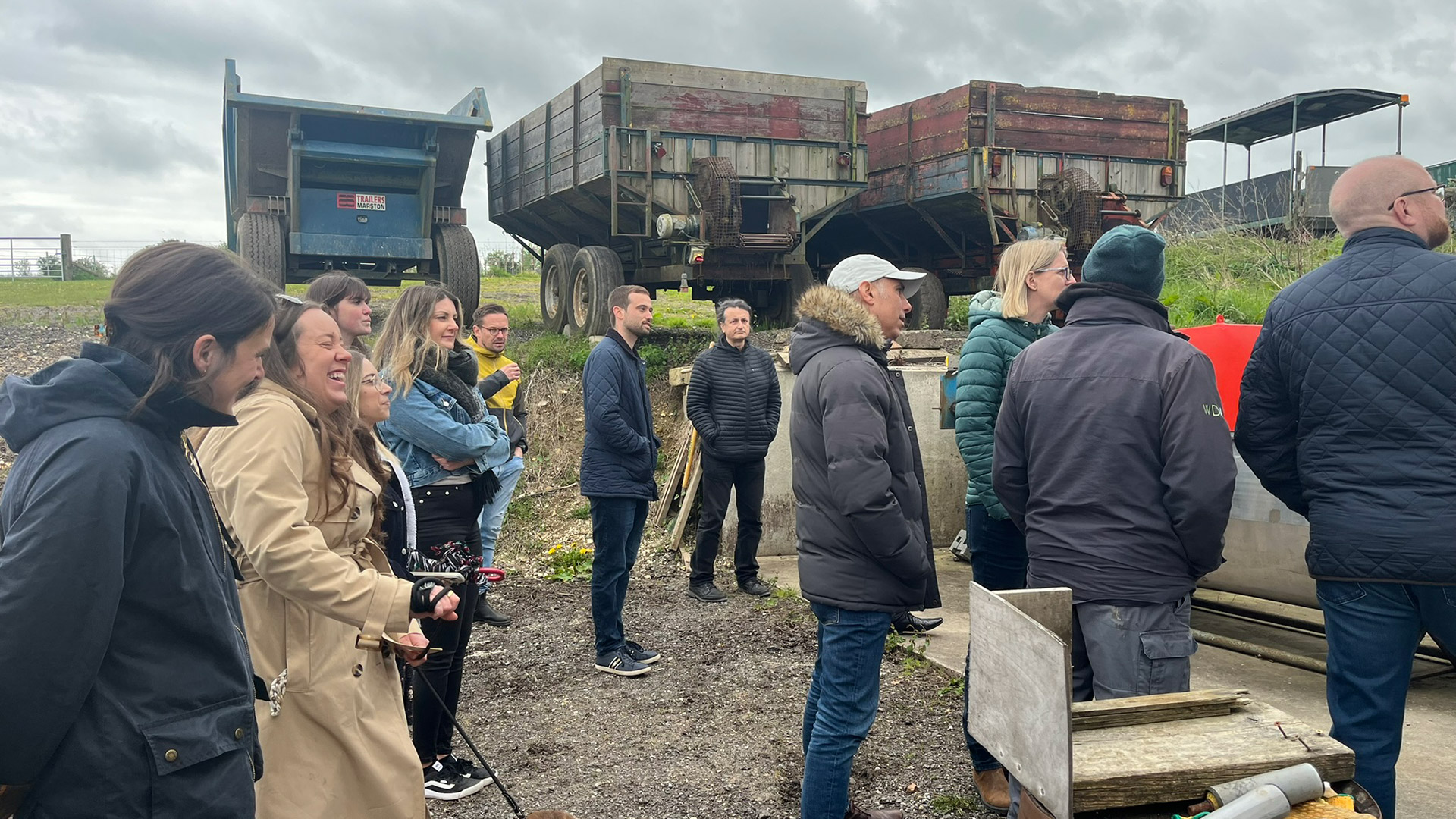 employees on cider tour looking at apple press