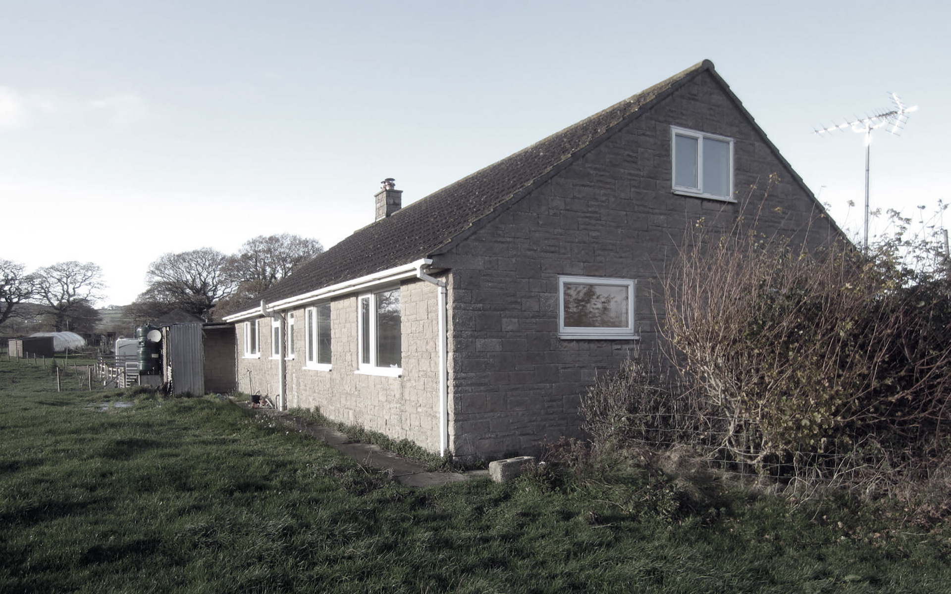 before photo of rear view of bungalow