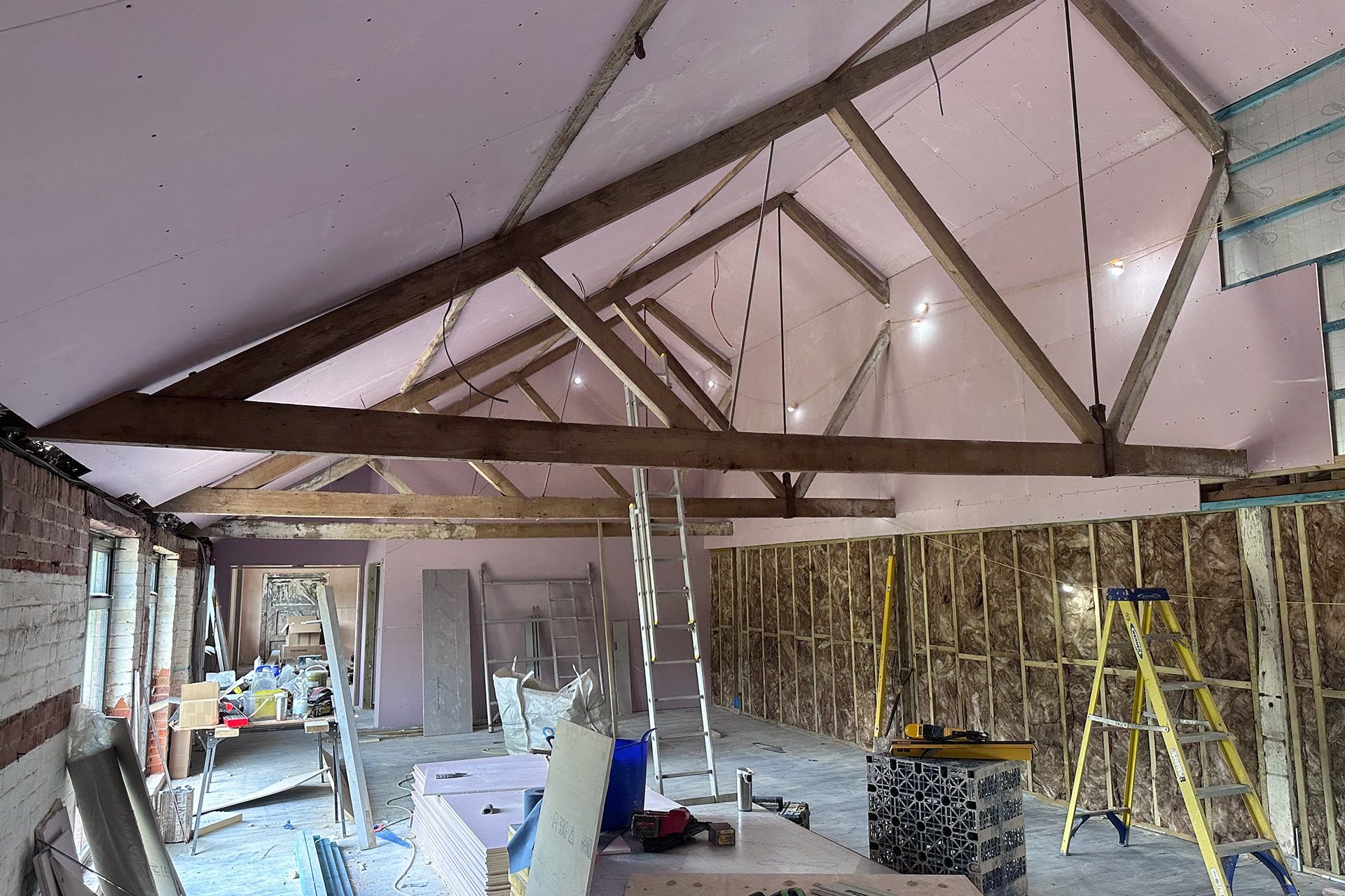 music room under construction with exposed beams
