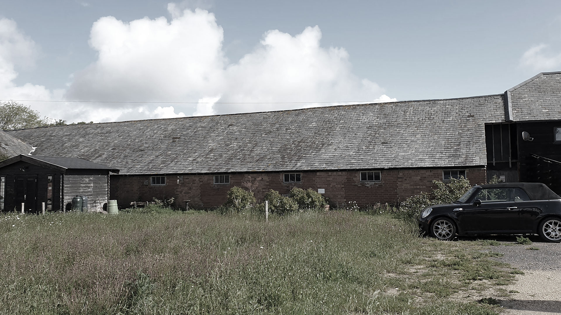 before photo of red brick music studio building with tiled roof