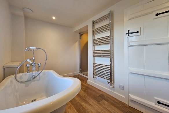 minimalist contemporary white bathroom with wooden floor