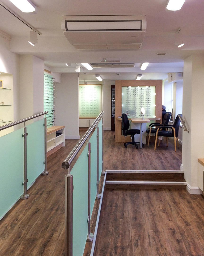 opticians shop with accessible ramp and steps to display area