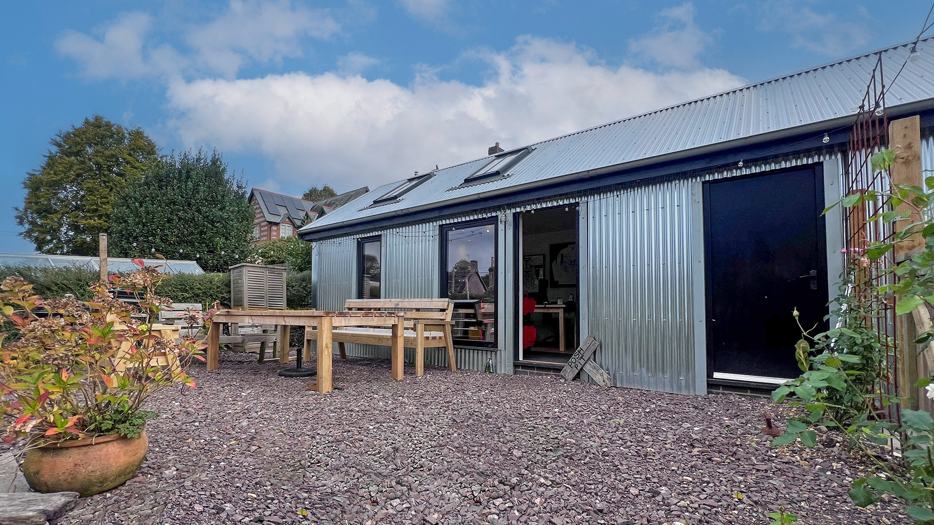 home office annex with corrugated walls and roof