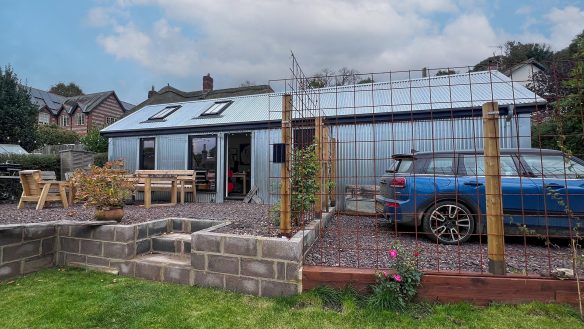 modern corrugated annex in garden