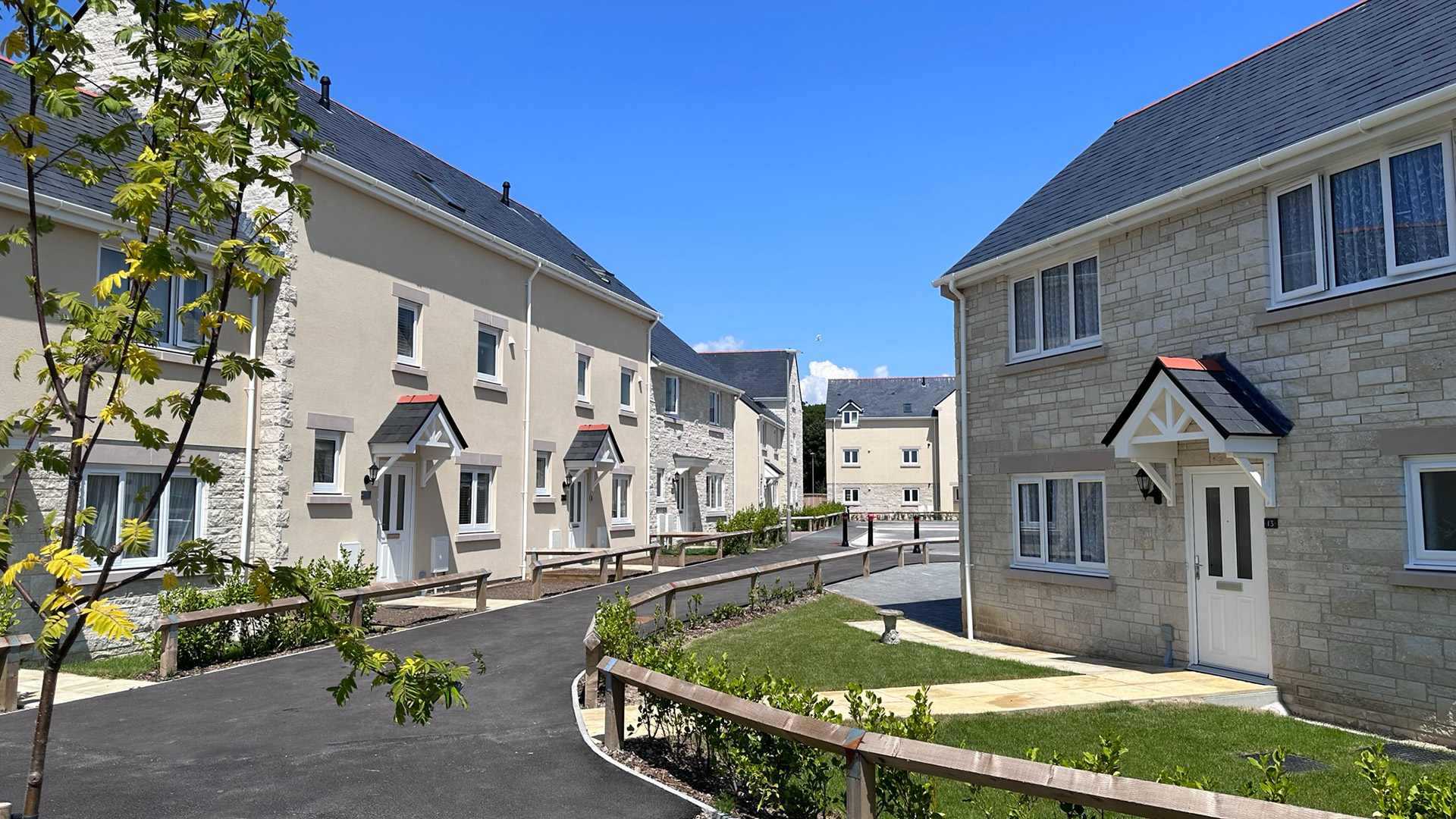new stone houses with pedestrian walkway