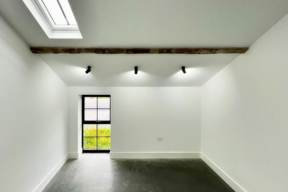 studio space in community building with concrete floors and spotlights