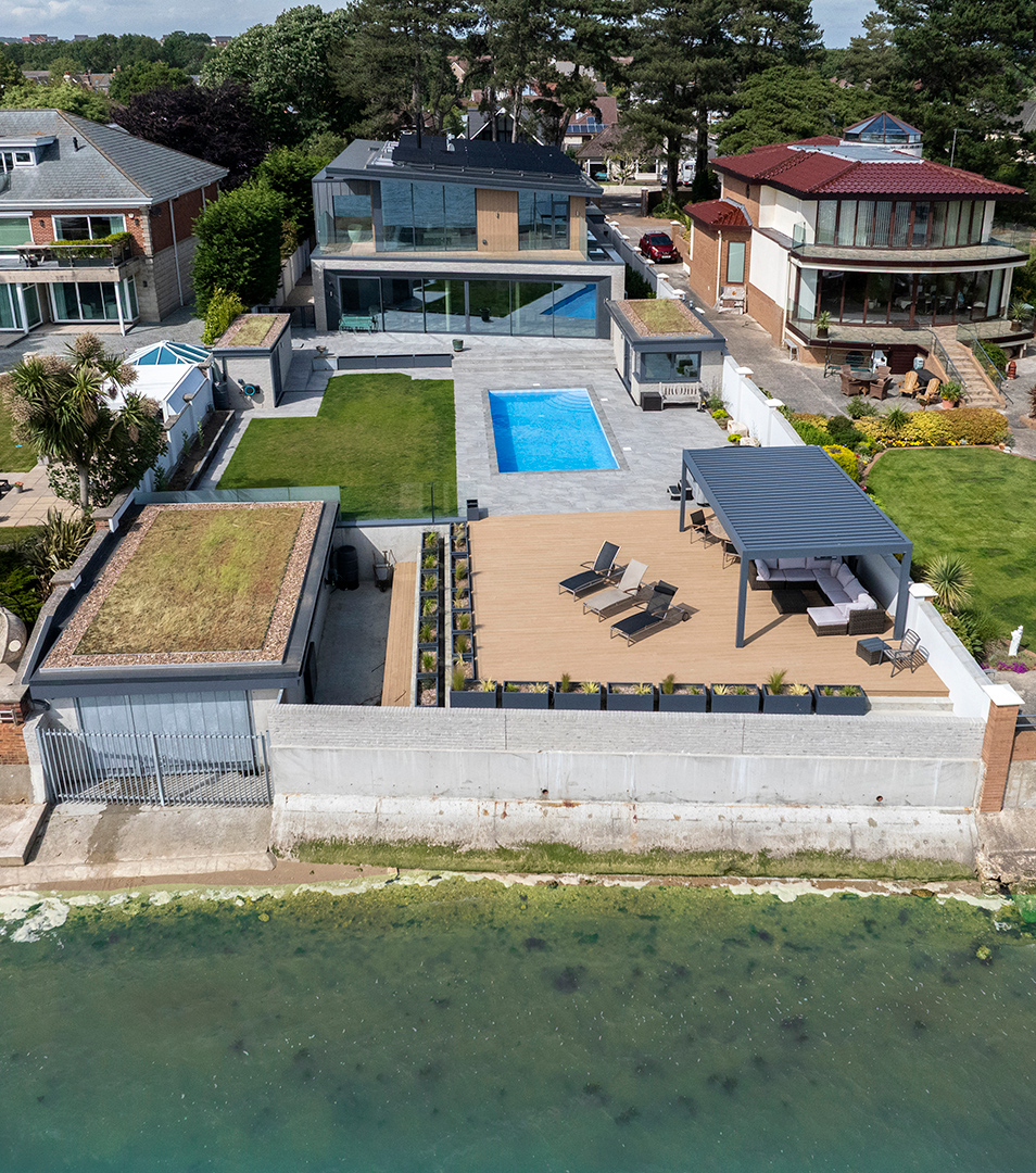 aerial view of contemporary house and garden with swimming pool