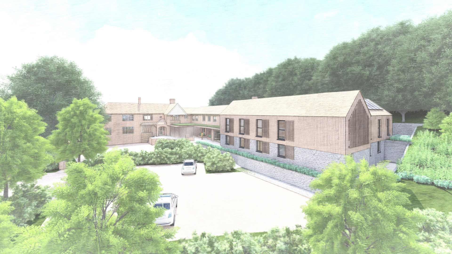 Aerial visual of contemporary extension to care home with wood cladding and large car park area