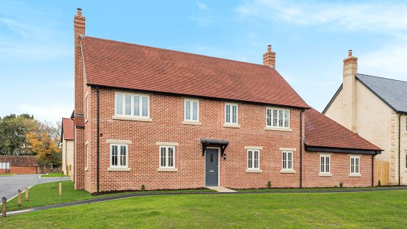 Large red brick house with red tiled roof