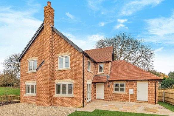 Detached brick house with feature chimney