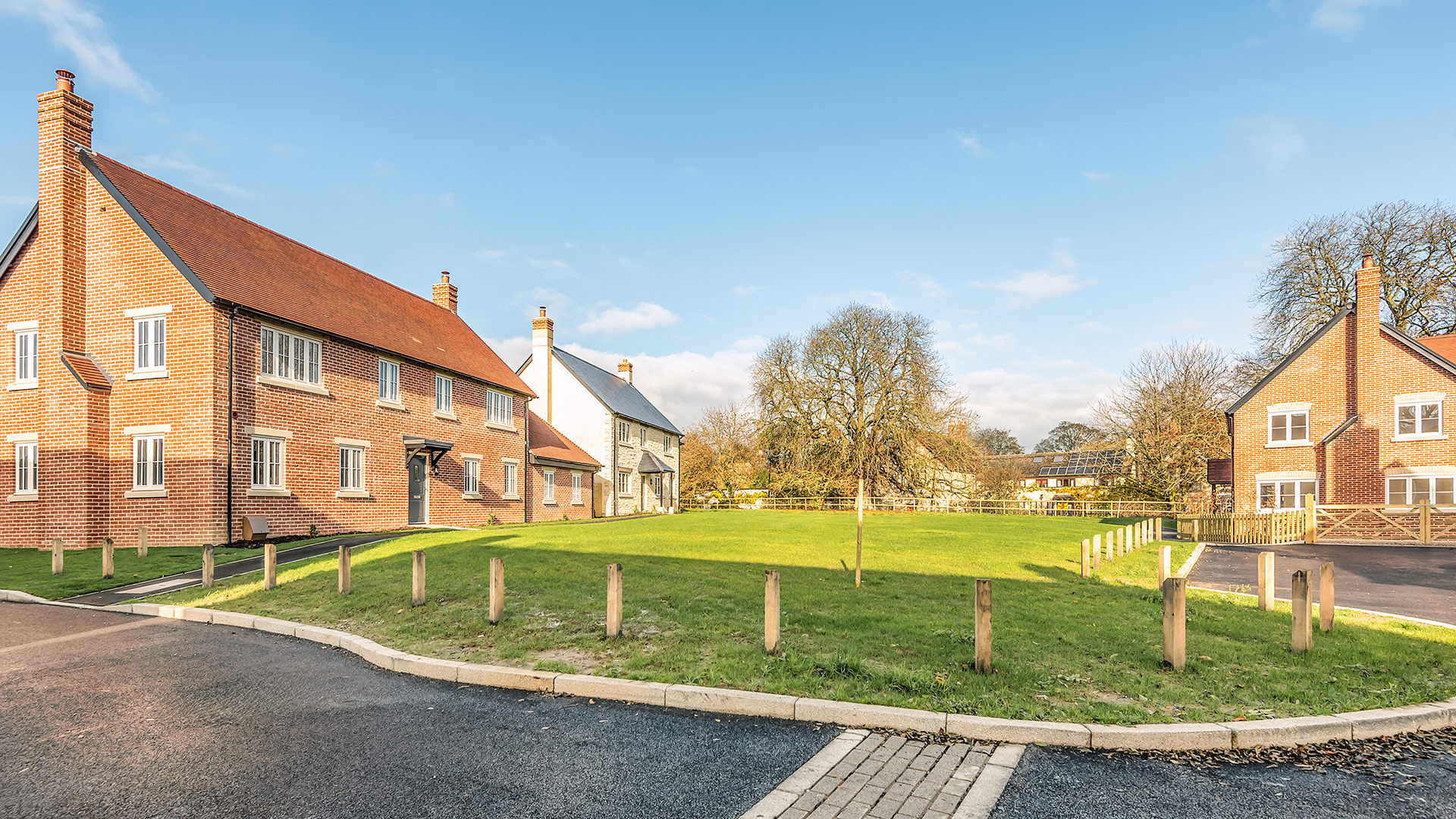Village green with red brick houses