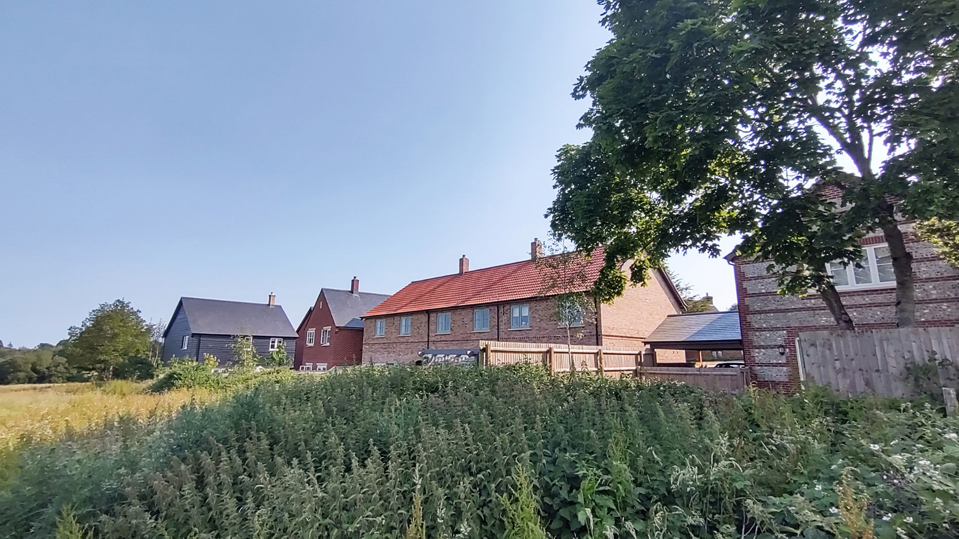 rear view of housing with red tiled roof