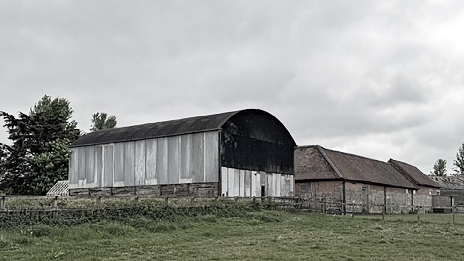 existing barn with curved roof