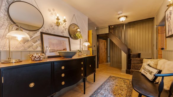 Entrance hall in residential house with seating area and staircase