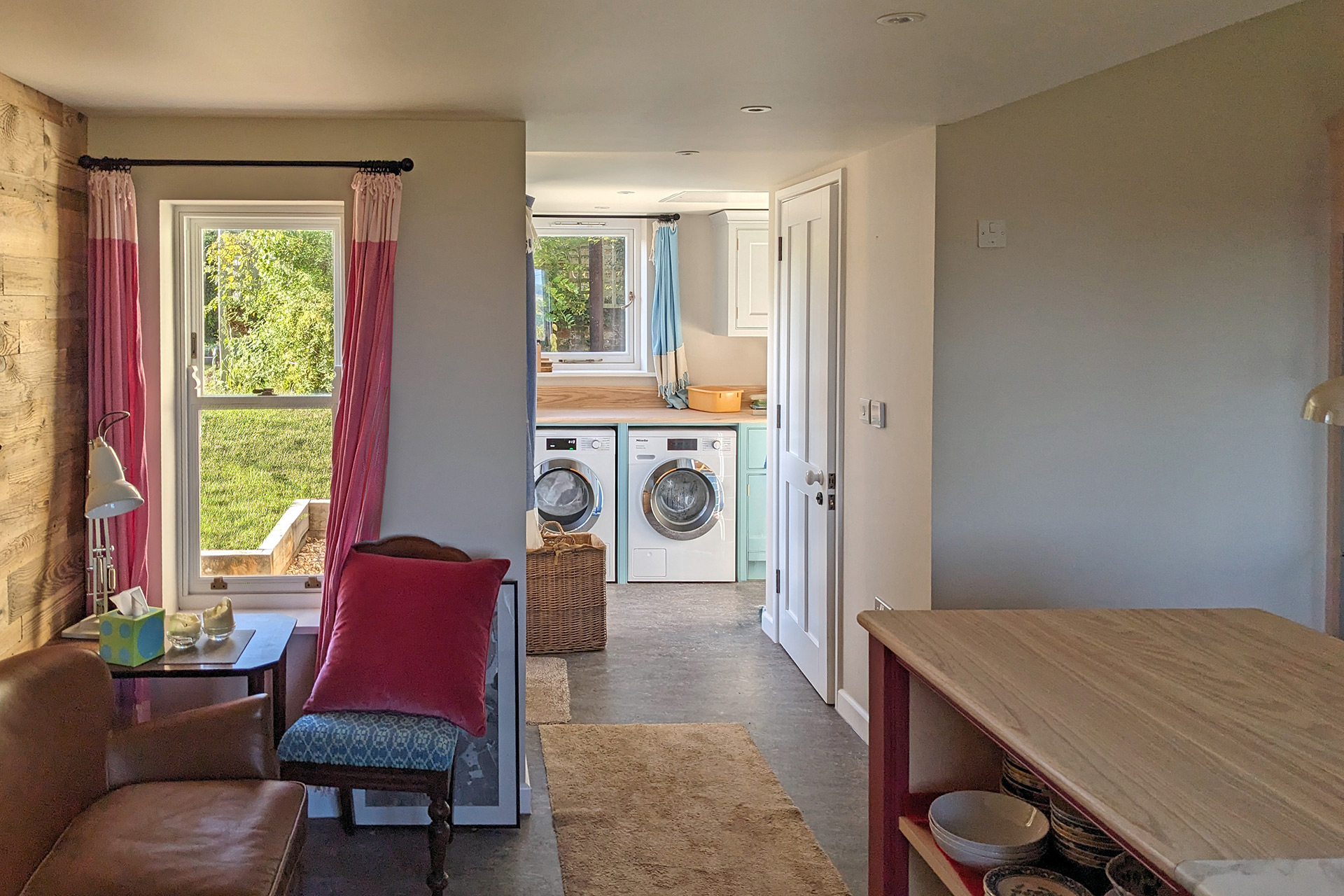 Internal seating area with hallway leading to utility room