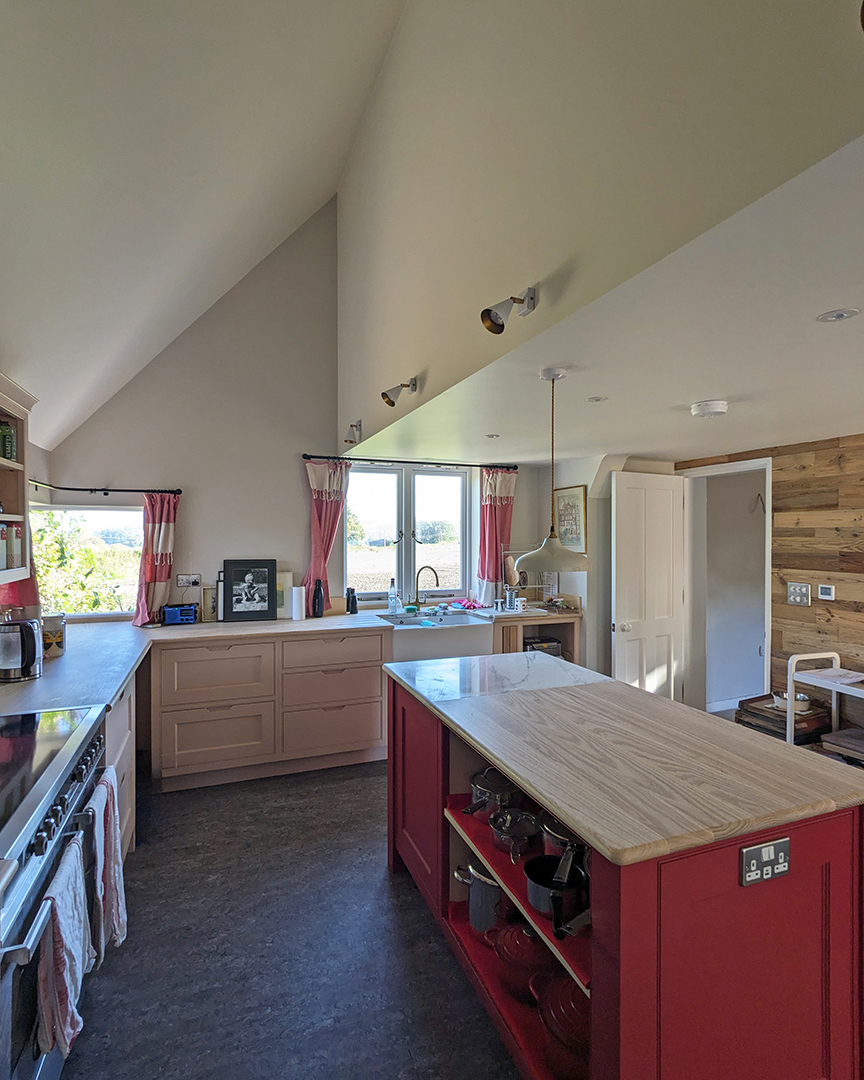 kitchen interior with vaulted ceiling and feature corner window