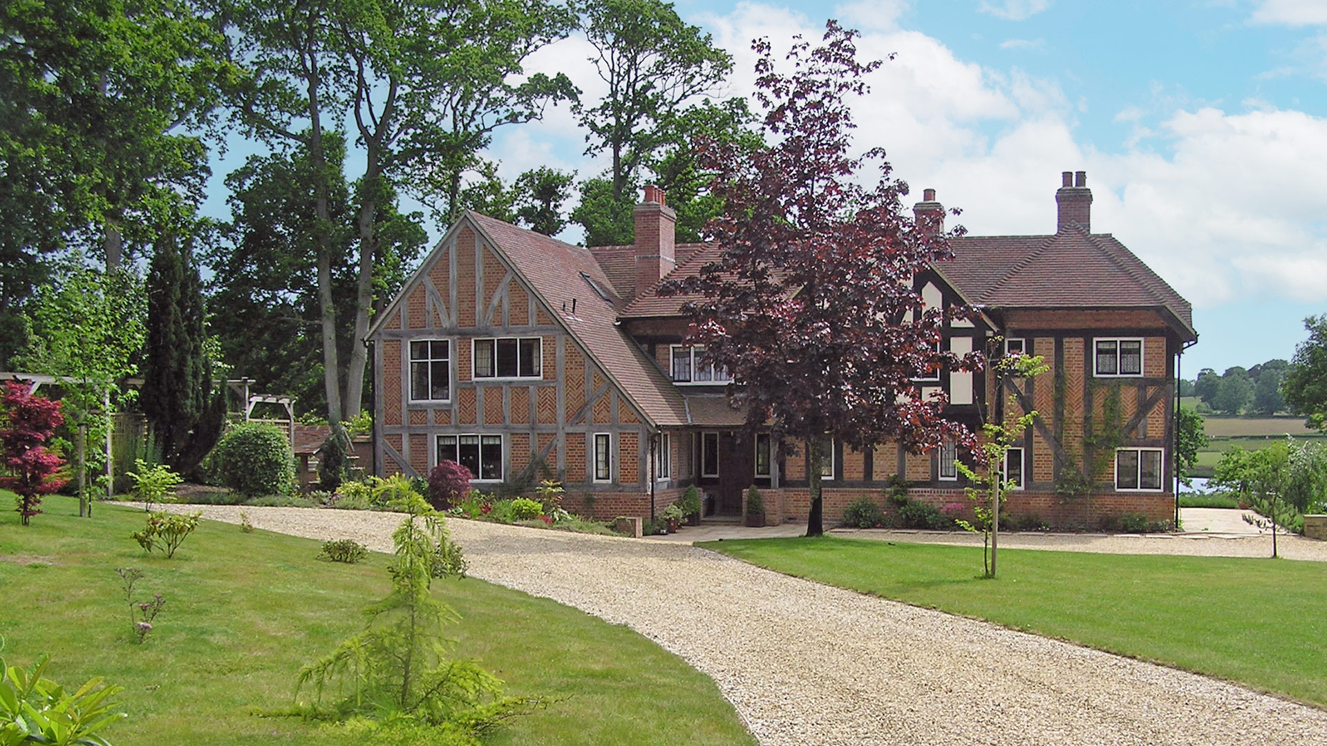 Approach view to historic residential house with extension