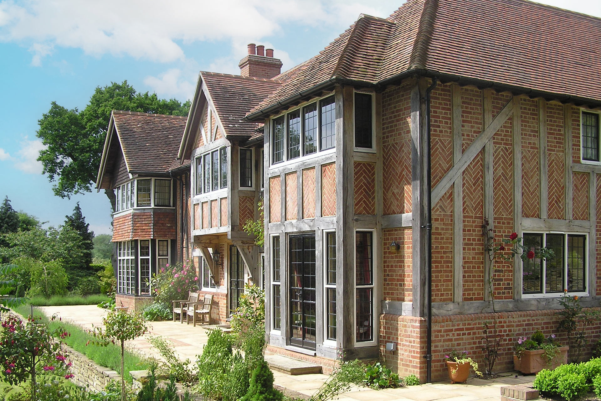side view of historic residential red brick house with timber detail