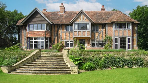 Rear elevation of historic house with red brick and timber detail