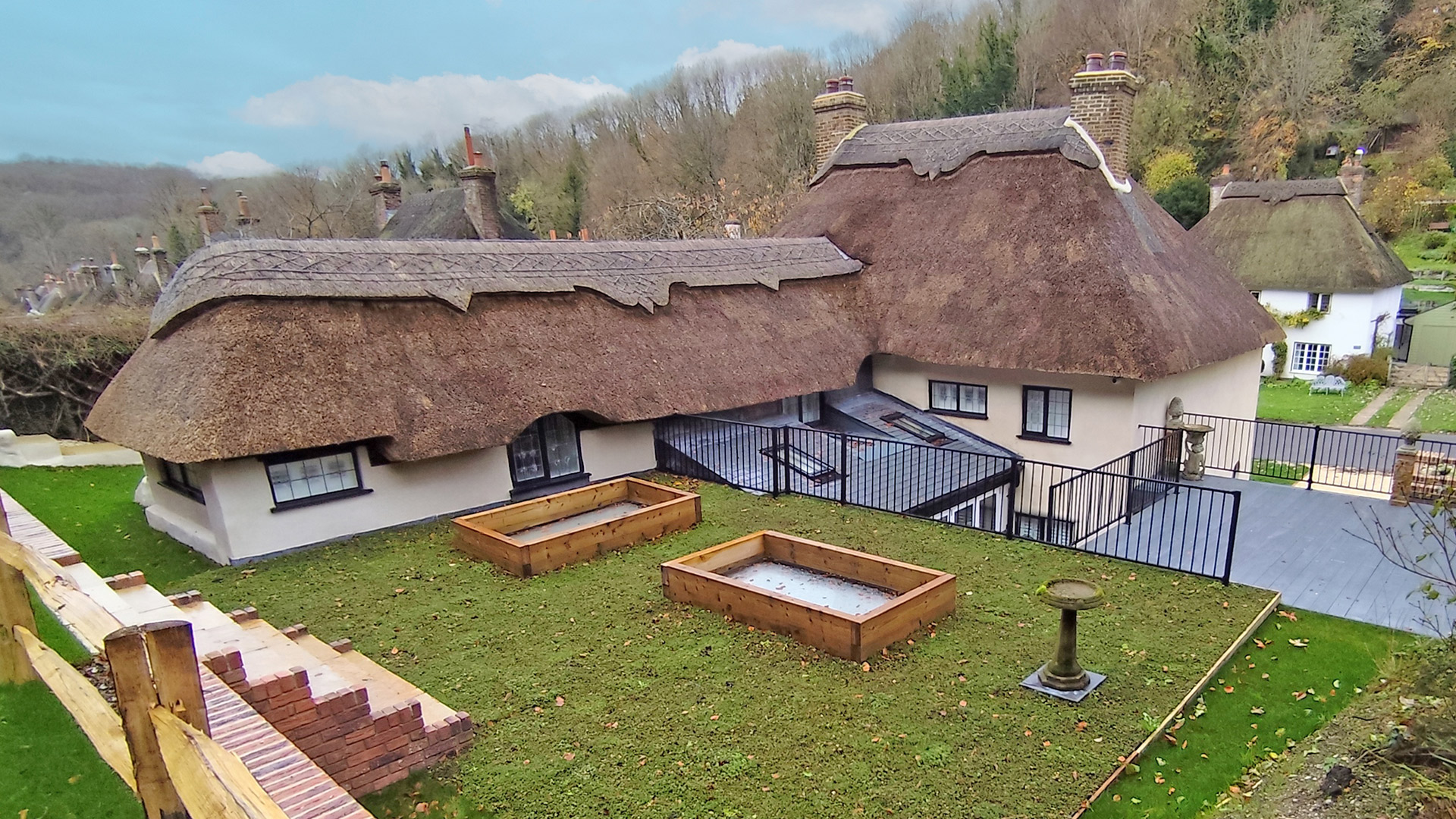 Sedum roof extension with skylights disguised as flower planters